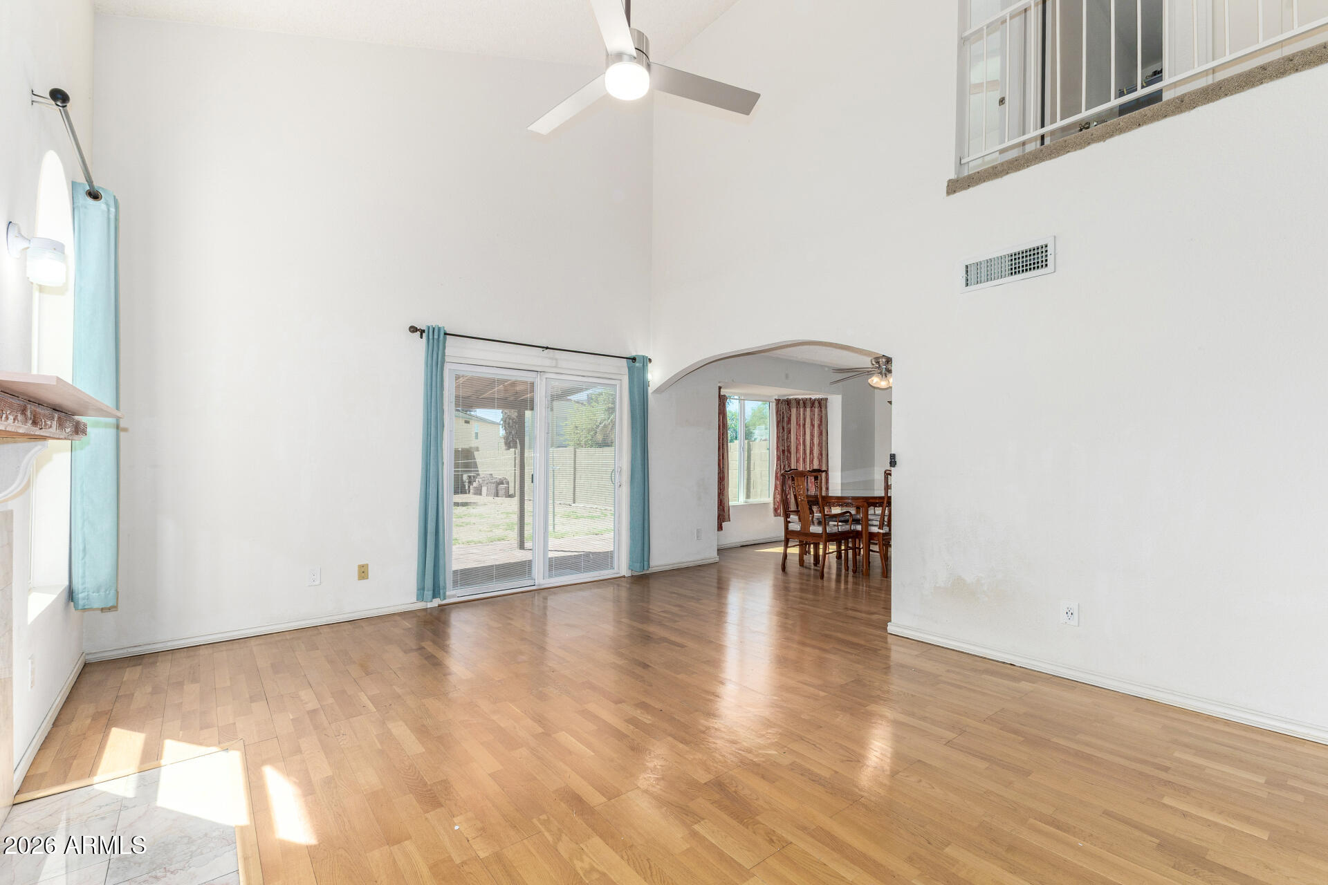 4741 West Marco Polo Road Glendale, AZ 85308 - Photo 6 of 32 a view of empty room with wooden floor and fan