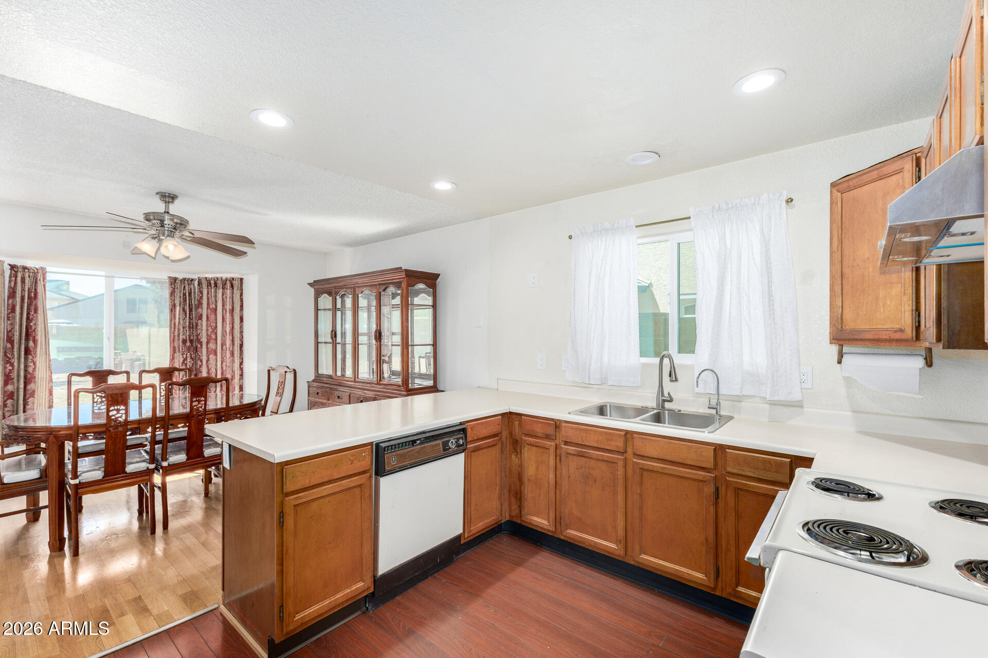 4741 West Marco Polo Road Glendale, AZ 85308 - Photo 8 of 32 a large white kitchen with a large window