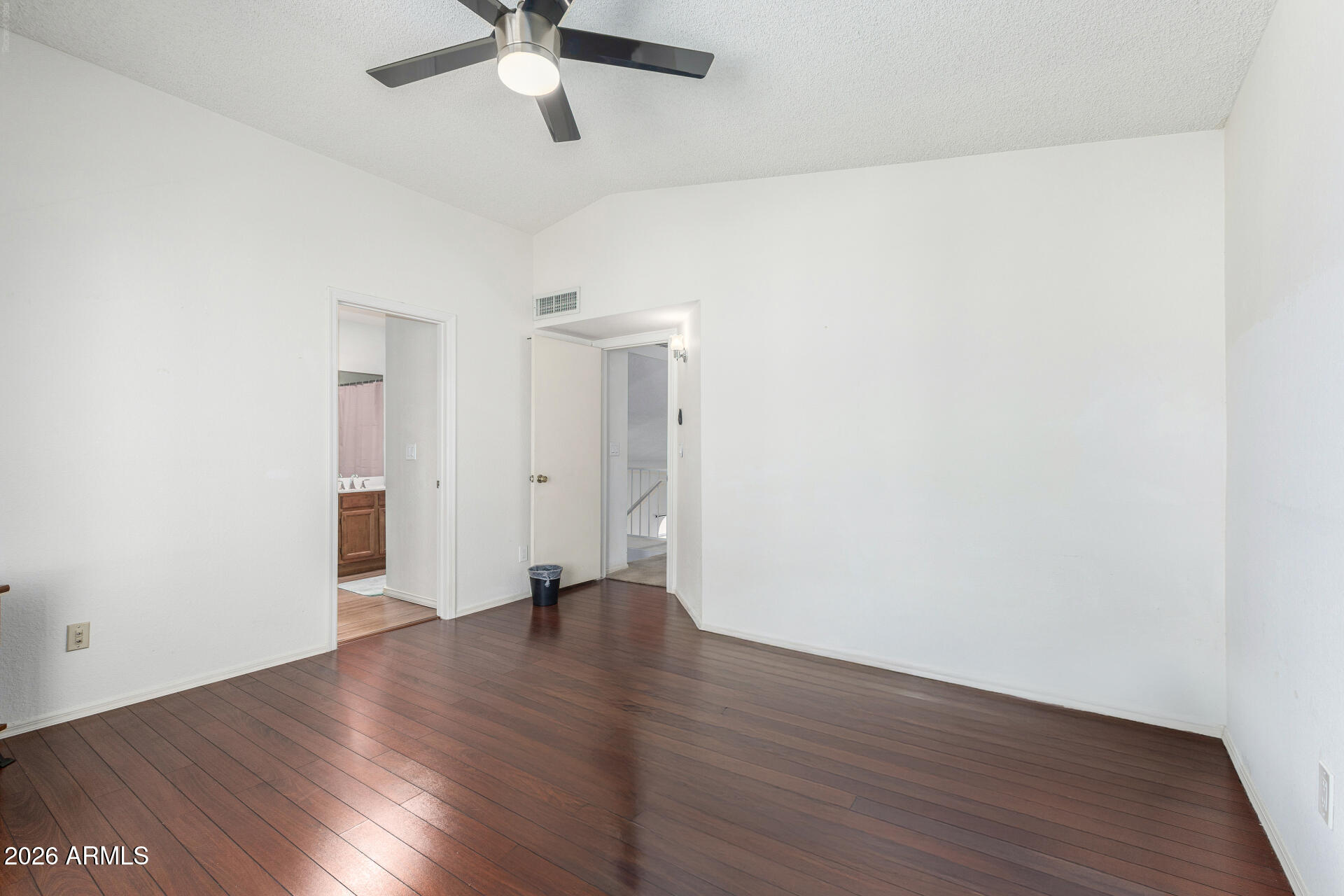 4741 West Marco Polo Road Glendale, AZ 85308 - Photo 14 of 32 an empty room with wooden floor ceiling fan and window