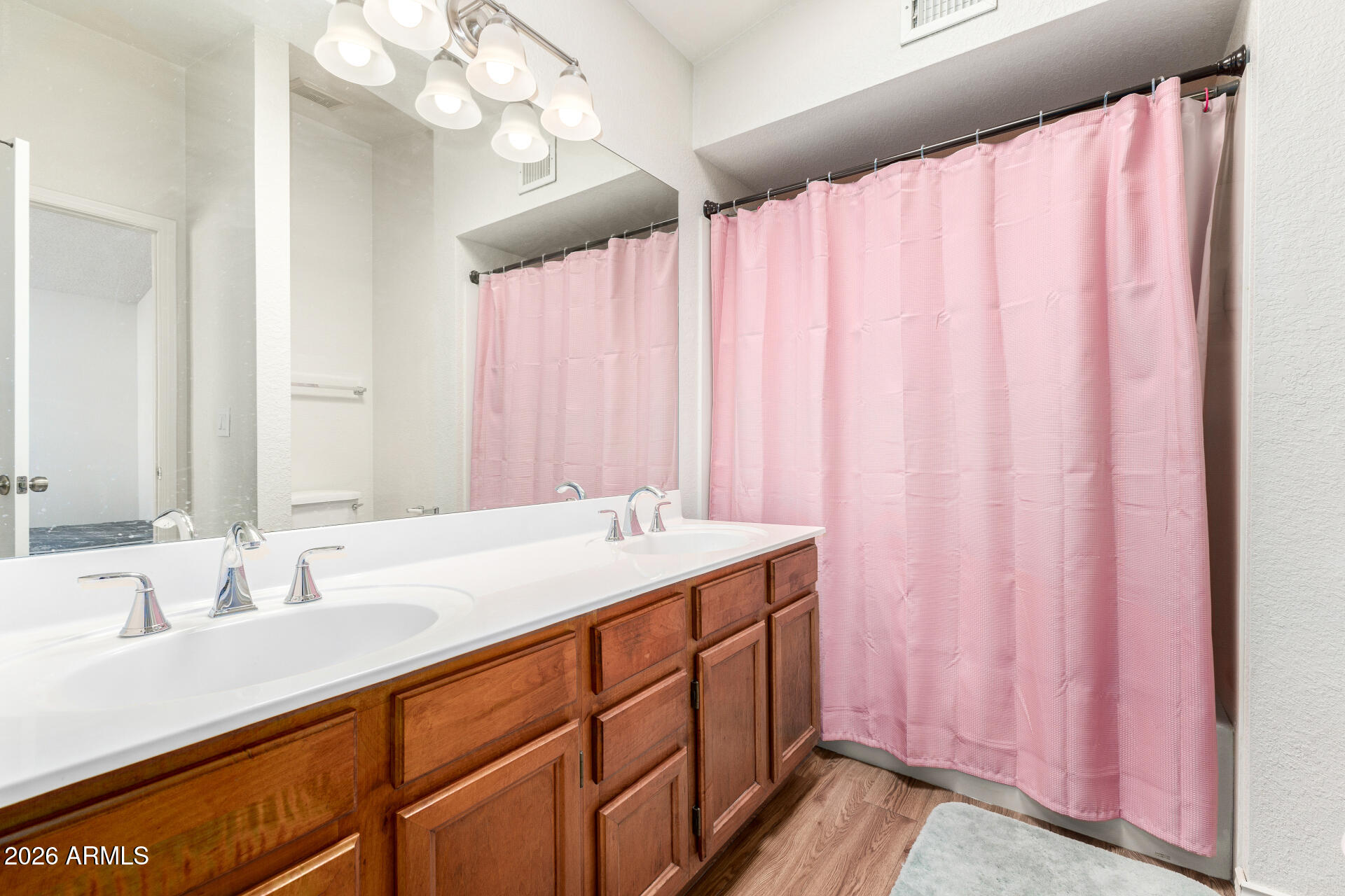 4741 West Marco Polo Road Glendale, AZ 85308 - Photo 15 of 32 a bathroom with a double vanity sink and a mirror