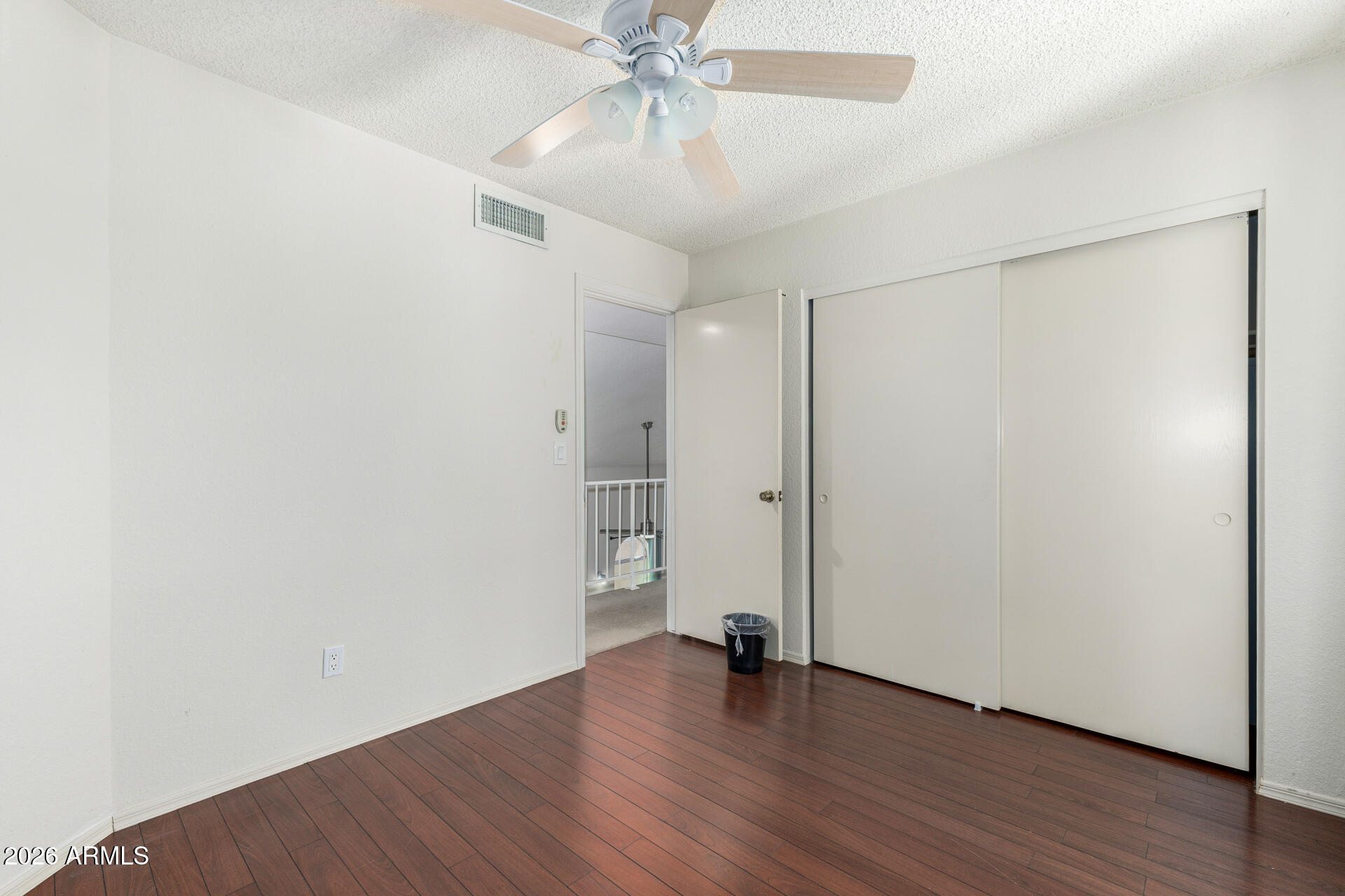 4741 West Marco Polo Road Glendale, AZ 85308 - Photo 17 of 32 a view of an empty room with wooden floor