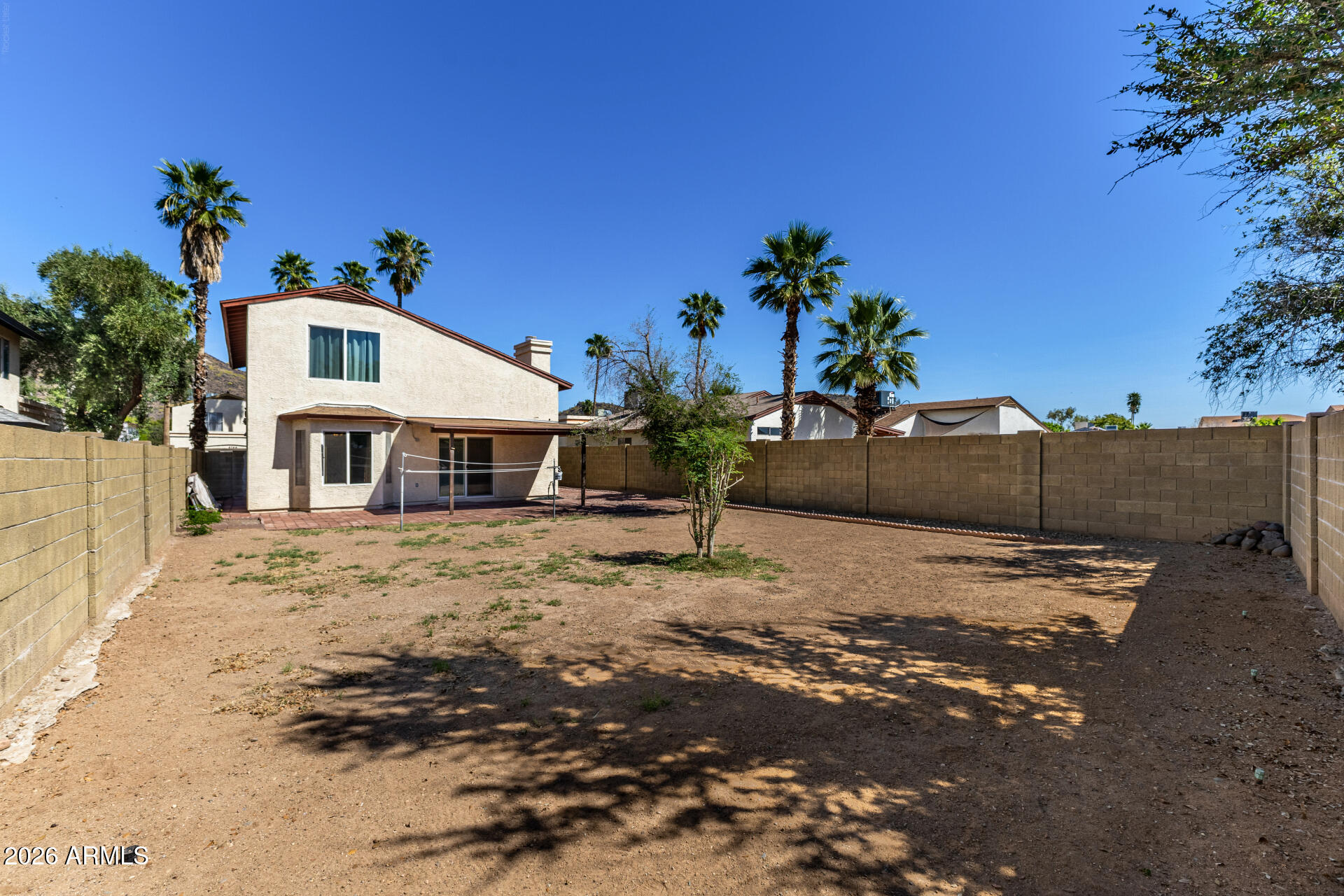 4741 West Marco Polo Road Glendale, AZ 85308 - Photo 25 of 32 a front view of a house with a yard