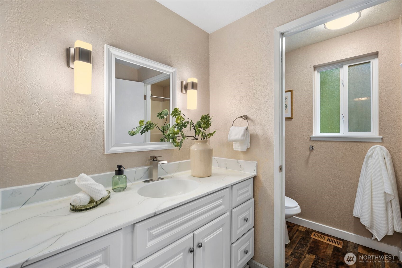 18016 Southeast 147th Street Renton, WA 98059 - Photo 17 of 38 a bathroom with a granite countertop sink and a mirror