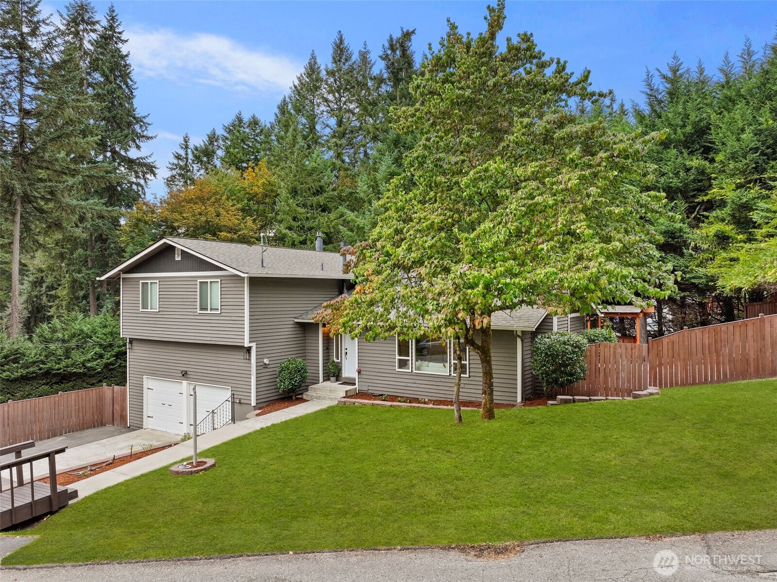 18016 Southeast 147th Street Renton, WA 98059 - Photo 2 of 38 a front view of a house with a yard