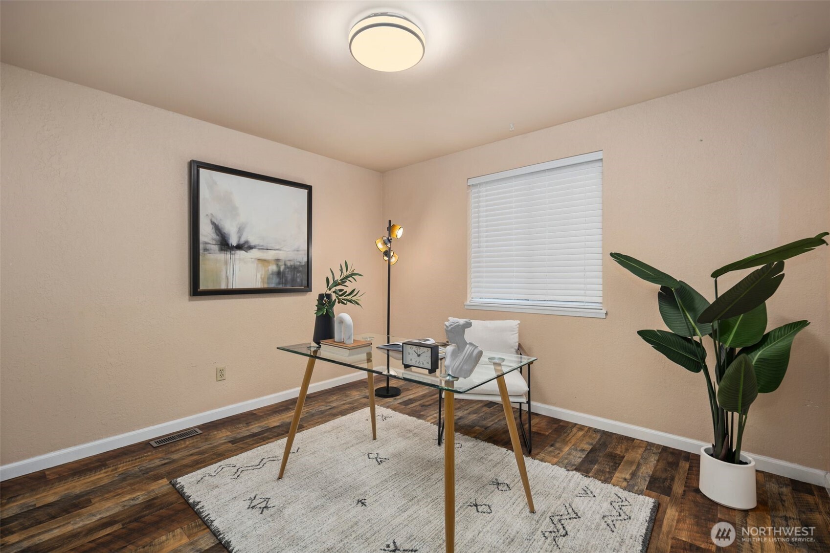 18016 Southeast 147th Street Renton, WA 98059 - Photo 21 of 38 a workspace with furniture and a potted plant