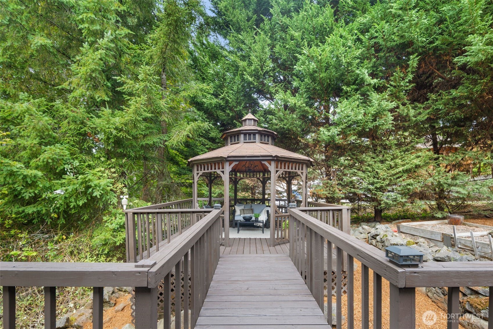18016 Southeast 147th Street Renton, WA 98059 - Photo 31 of 38 a balcony with wooden floor and outdoor seating