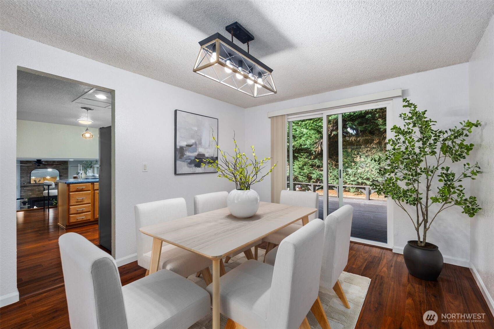 18016 Southeast 147th Street Renton, WA 98059 - Photo 10 of 38 a view of a dining room with furniture window and wooden floor