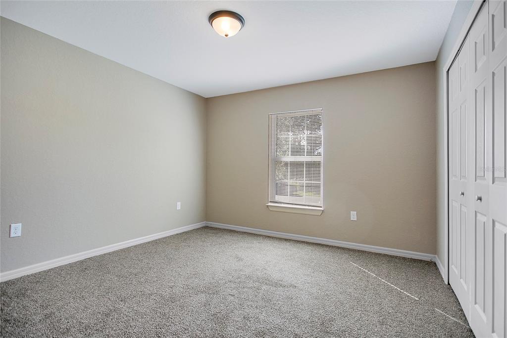 6949 Southwest 152nd Street Ocala, FL 34473 - Photo 14 of 20 an empty room with a window