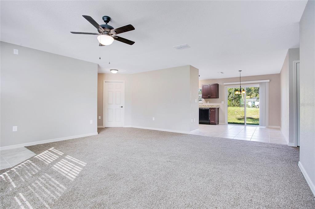 6949 Southwest 152nd Street Ocala, FL 34473 - Photo 4 of 20 a view of an empty room with a window