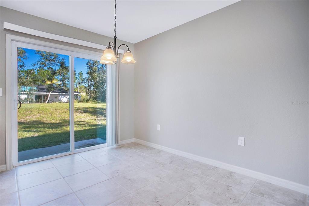 6949 Southwest 152nd Street Ocala, FL 34473 - Photo 8 of 20 a view of an empty room with windows