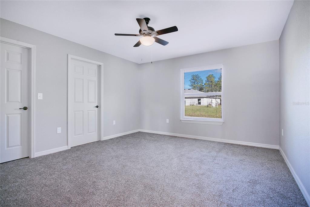 6949 Southwest 152nd Street Ocala, FL 34473 - Photo 9 of 20 a view of empty room with ceiling fan