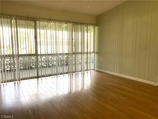 a view of a double vanity sink mirror and cabinets