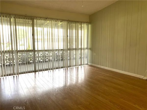 a view of a double vanity sink mirror and cabinets