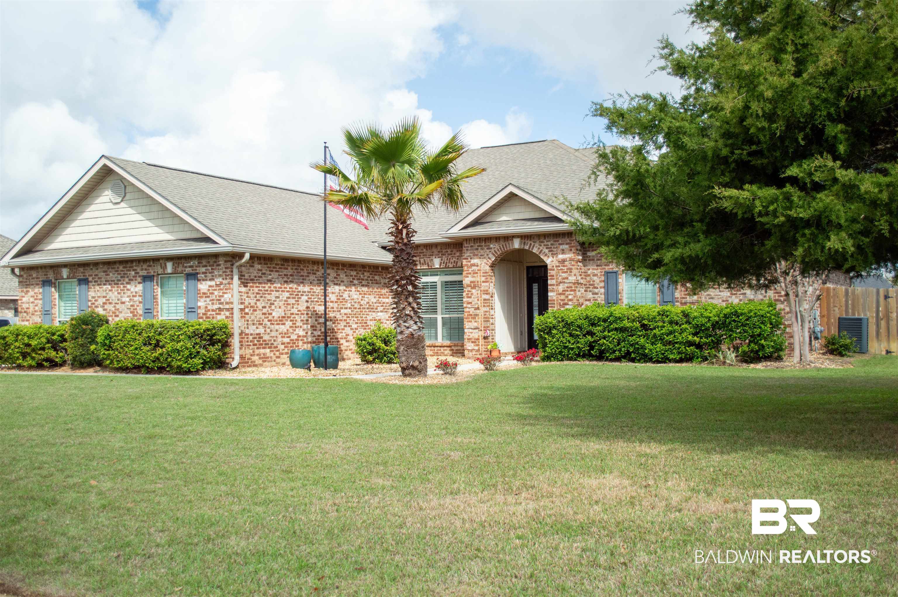 1124 West Orlando Drive Foley, AL 36535 - Photo 4 of 51 View of front facade featuring roof with shingles and brick siding
