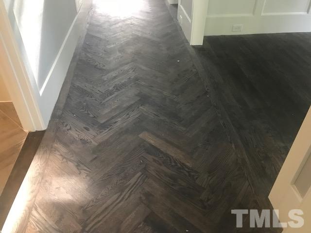 5000 Fanyon Way Raleigh, NC 27612 - Photo 7 of 25 Site finished hardwood floors throughout main level. Stain may vary per selections.