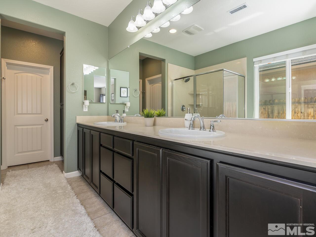 2090 Tawleed Road Reno, NV 89521 - Photo 13 of 24 a bathroom with a sink double vanity and a mirror