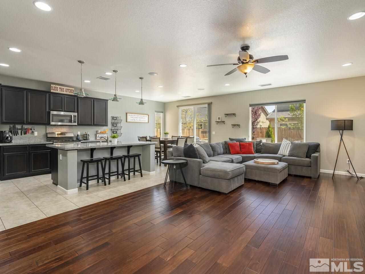 2090 Tawleed Road Reno, NV 89521 - Photo 3 of 24 a living room with furniture kitchen view and a wooden floor