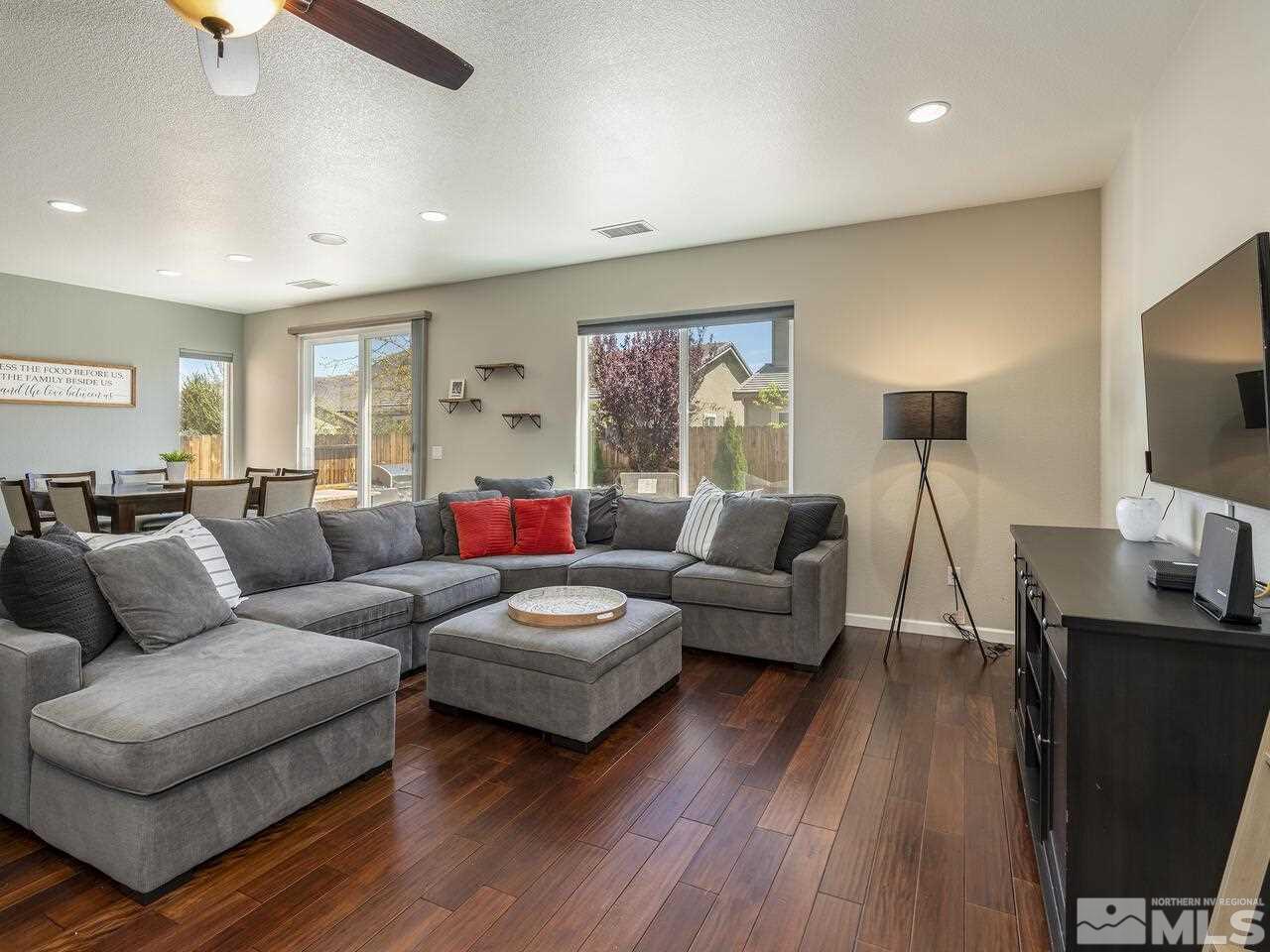 2090 Tawleed Road Reno, NV 89521 - Photo 4 of 24 a living room with furniture flat screen tv and wooden floor