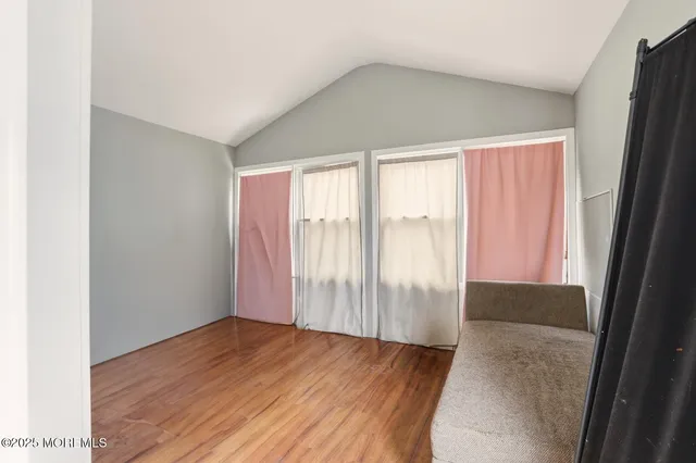 a kitchen with granite countertop a refrigerator and a sink