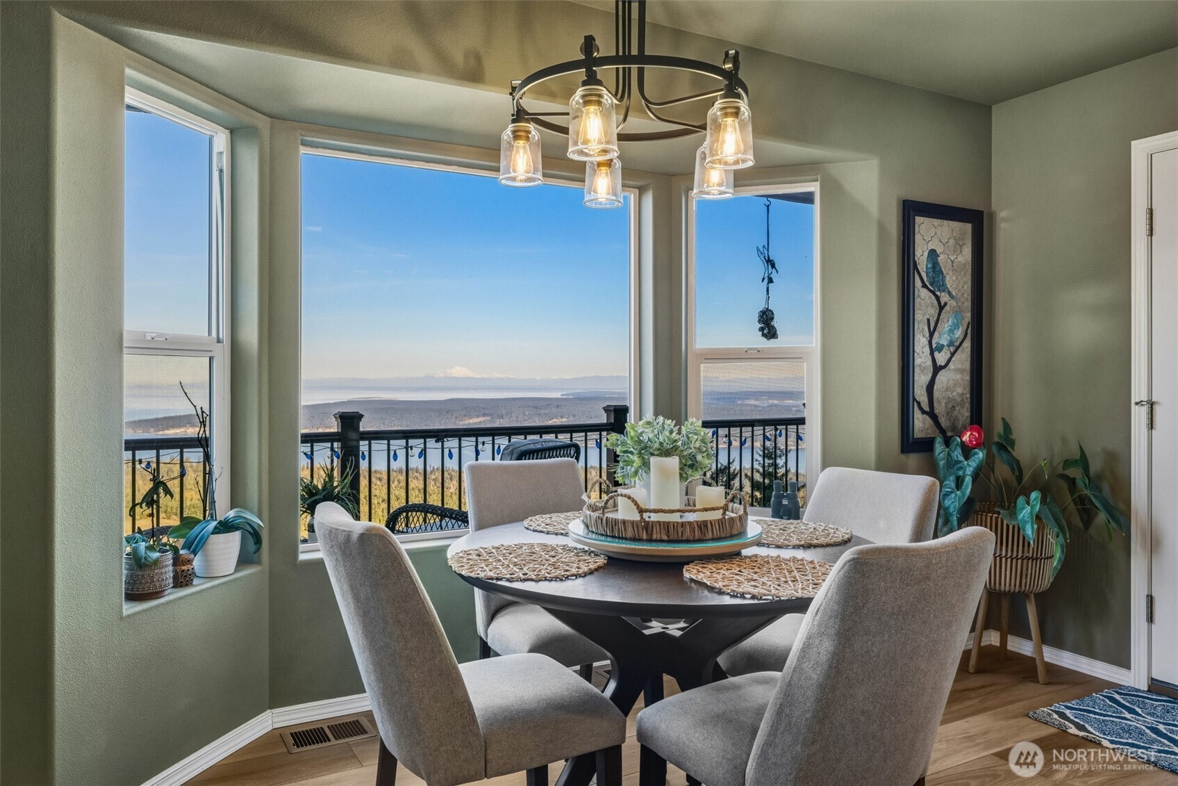 855 Louella Heights Road Sequim, WA 98382 - Photo 11 of 40 a view of a dining room with furniture window and wooden floor