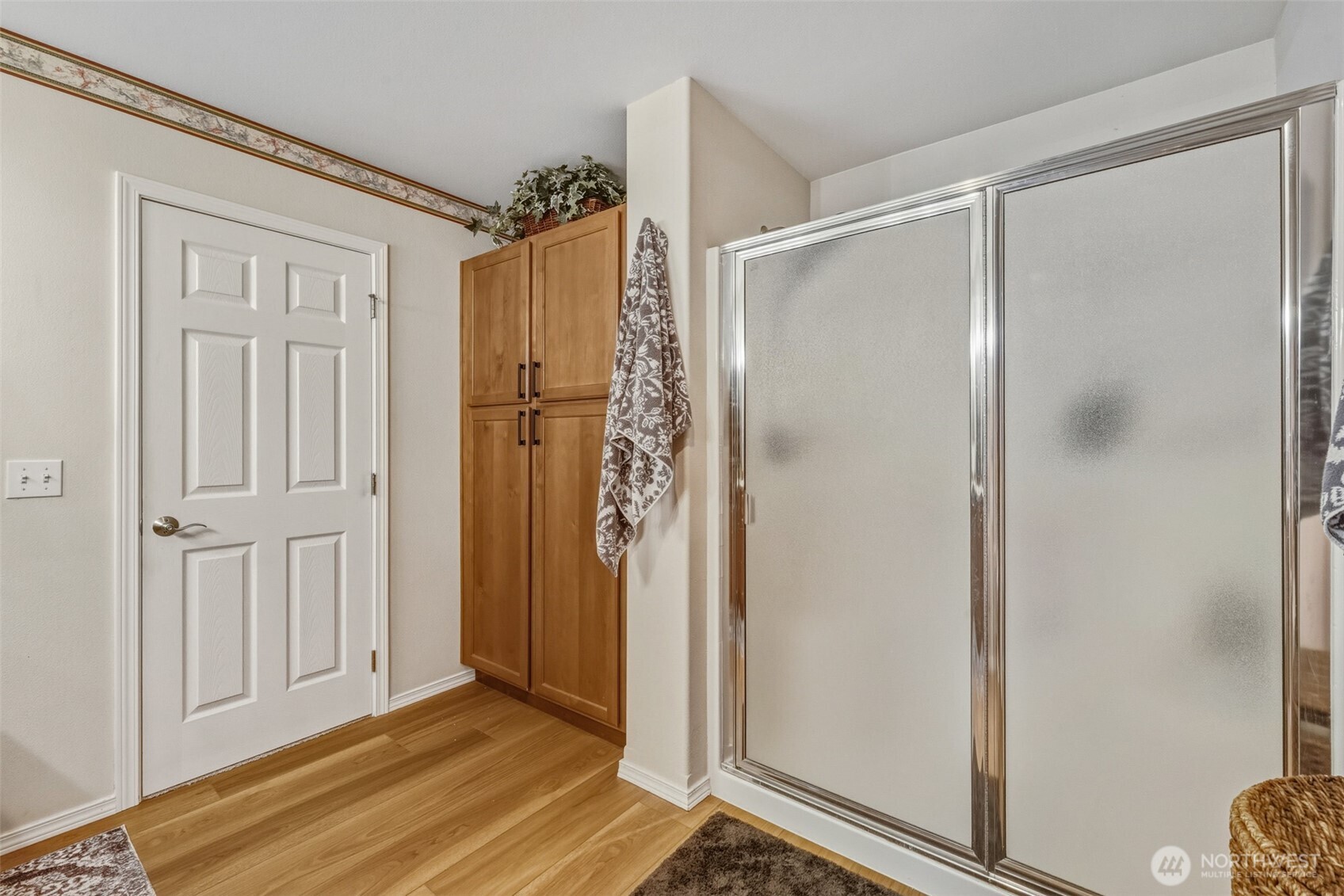 855 Louella Heights Road Sequim, WA 98382 - Photo 25 of 40 a view of a bathroom with a glass door