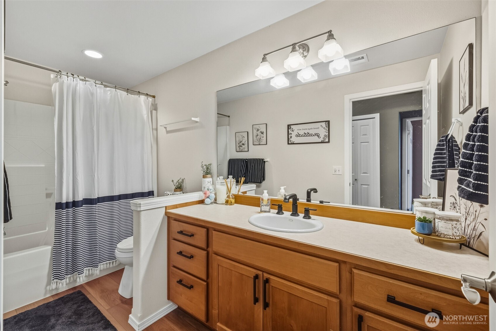 855 Louella Heights Road Sequim, WA 98382 - Photo 28 of 40 a bathroom with a double vanity sink mirror and toilet
