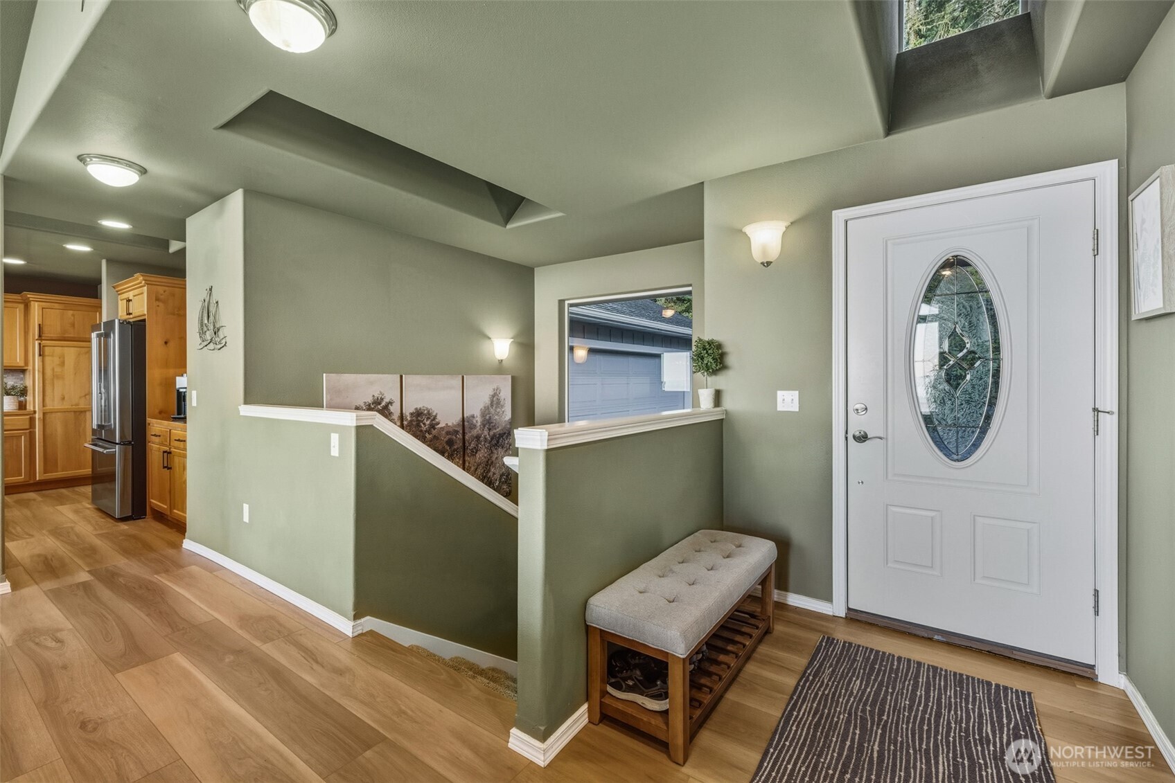 855 Louella Heights Road Sequim, WA 98382 - Photo 33 of 40 a room with a chair and wooden floor