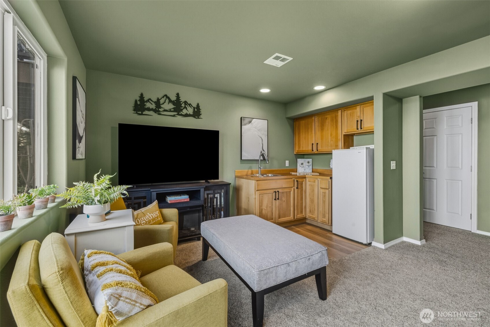 855 Louella Heights Road Sequim, WA 98382 - Photo 35 of 40 a living room with furniture and a flat screen tv