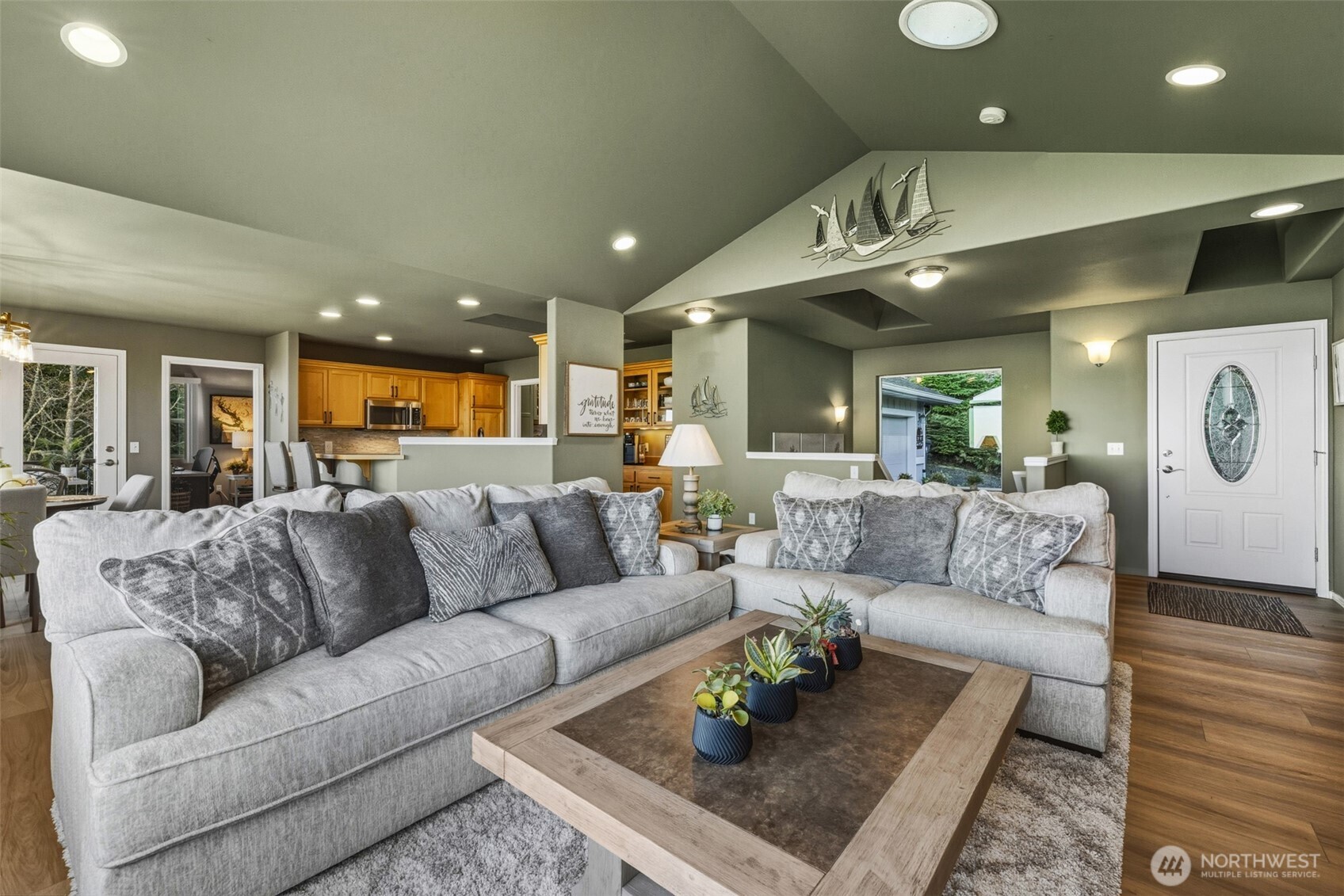 855 Louella Heights Road Sequim, WA 98382 - Photo 8 of 40 a living room with furniture kitchen view and a table