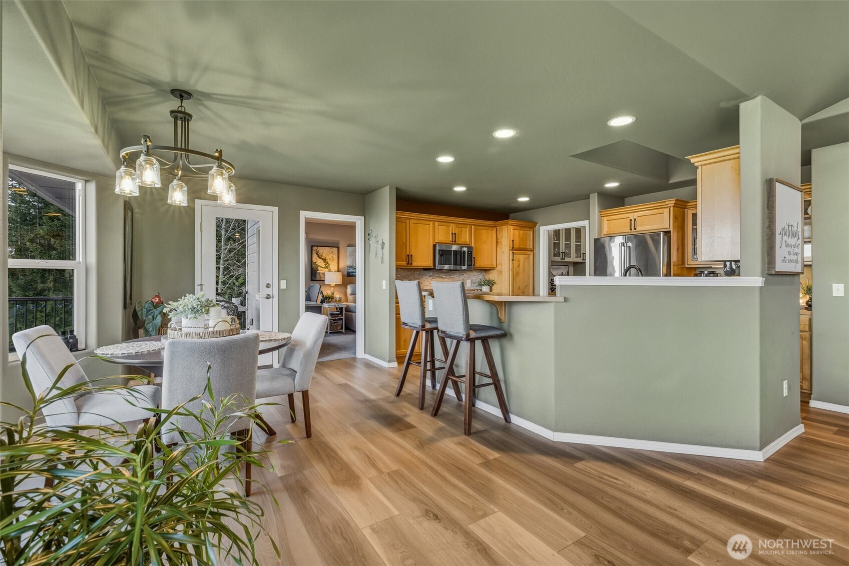855 Louella Heights Road Sequim, WA 98382 - Photo 10 of 40 a view of a dining room with furniture and a chandelier