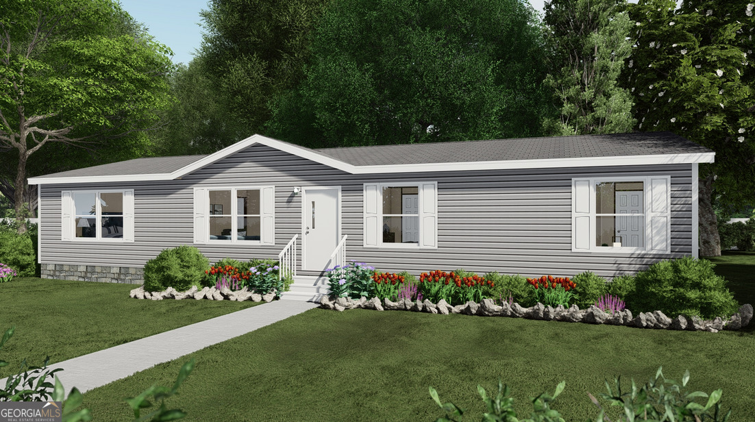 856 Bethel Church Road Carrollton, GA 30117 - Photo 1 of 1 a front view of a house with a garden