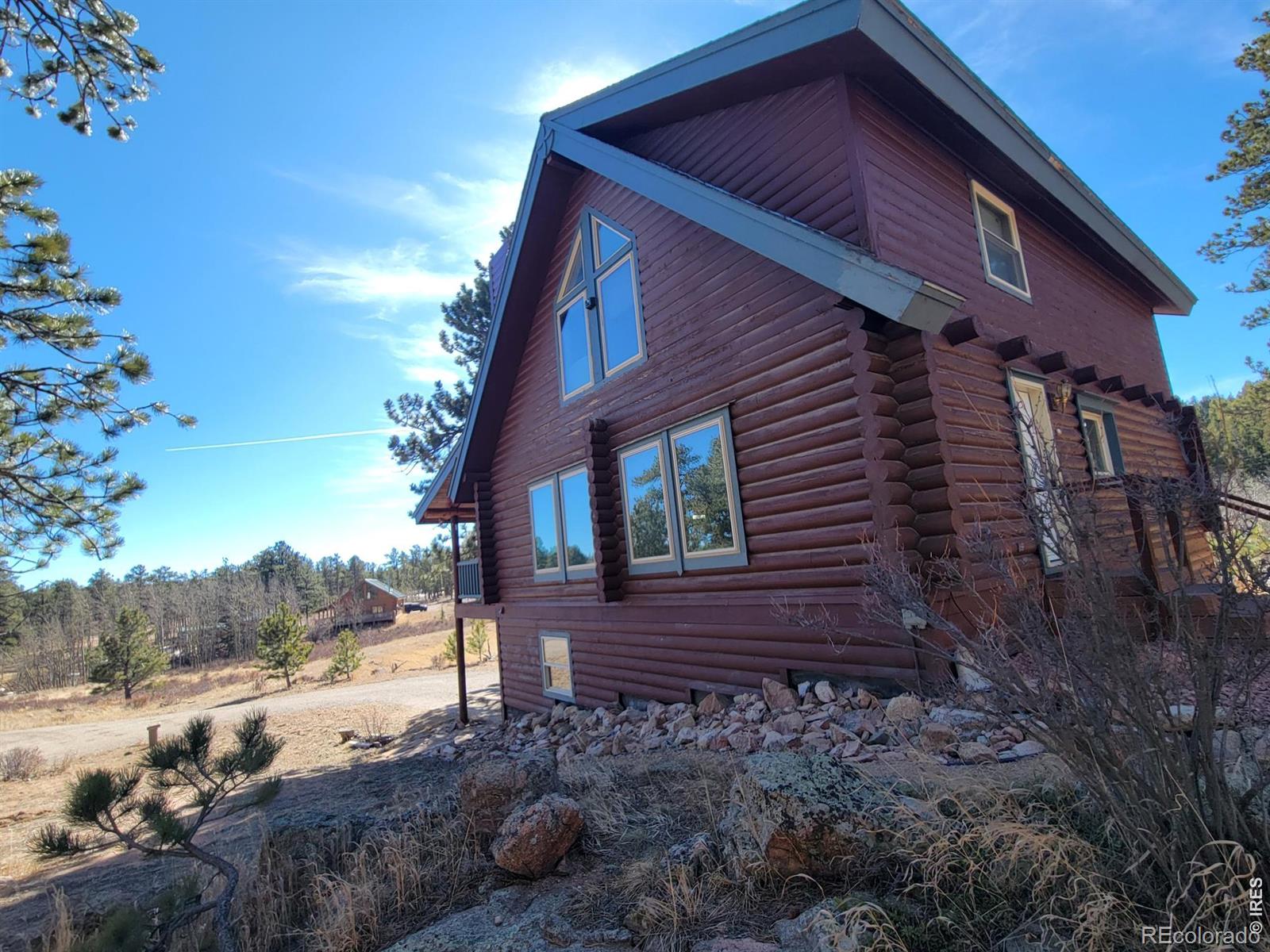 2225 North County Road Red Feather Lakes, CO 80545 - Photo 9 of 21 a view of a house with a yard