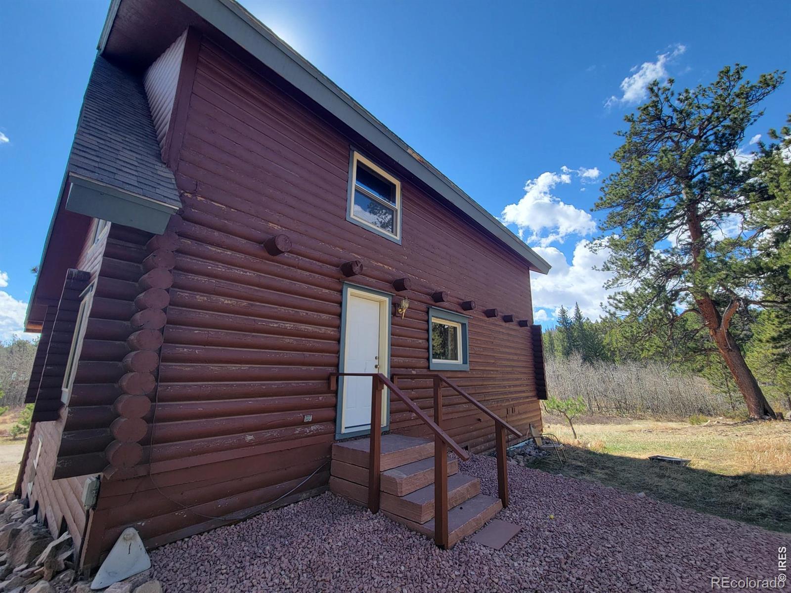 2225 North County Road Red Feather Lakes, CO 80545 - Photo 10 of 21 a view of a house with a yard