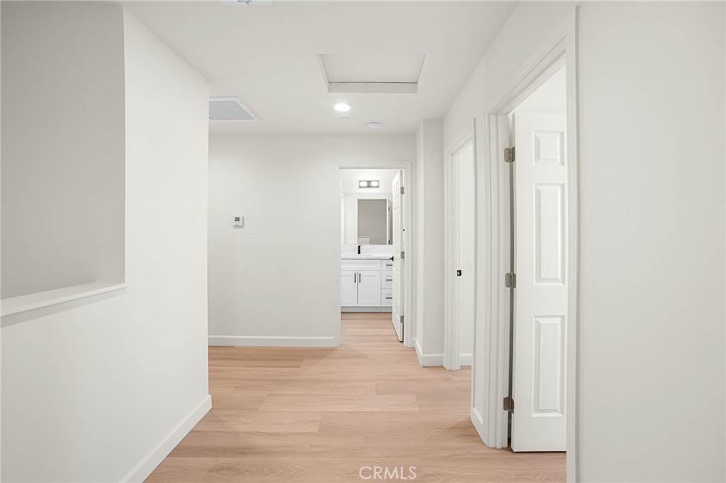306 West Congress Street Colton, CA 92324 - Photo 13 of 28 a view of a hallway with wooden shelves