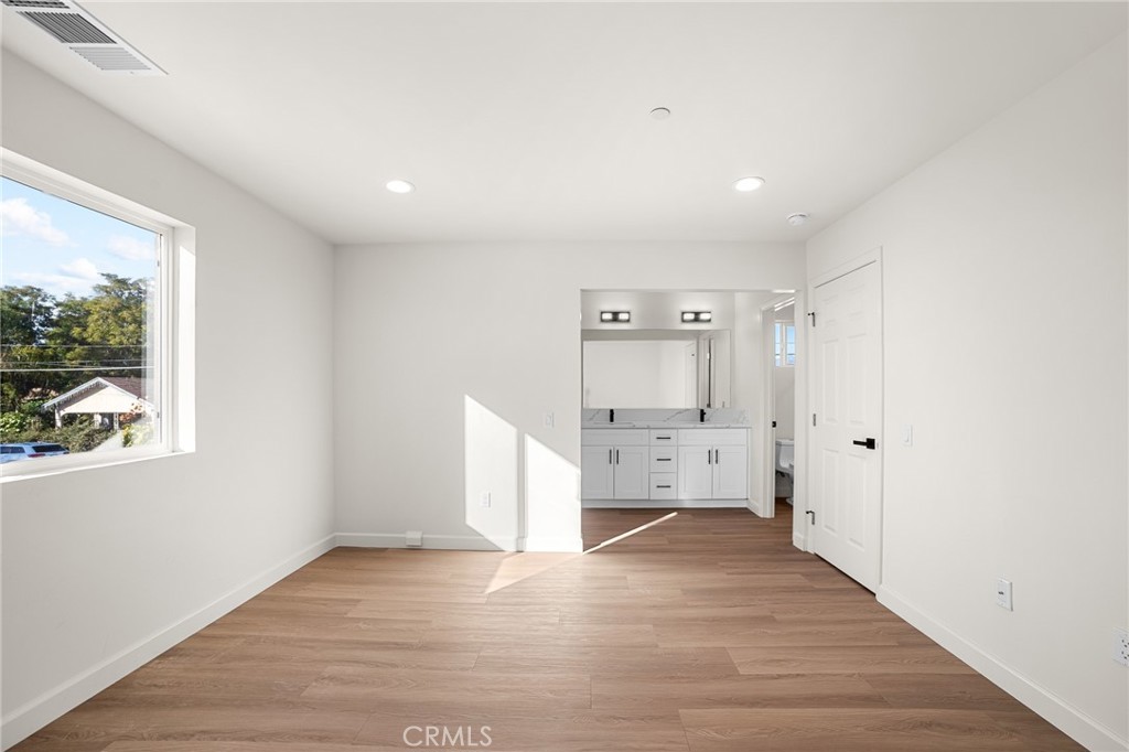 306 West Congress Street Colton, CA 92324 - Photo 20 of 28 a view of empty room with wooden floor