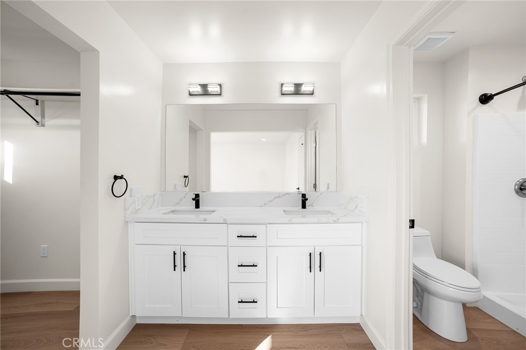 306 West Congress Street Colton, CA 92324 - Photo 21 of 28 a bathroom with a sink a toilet and a mirror