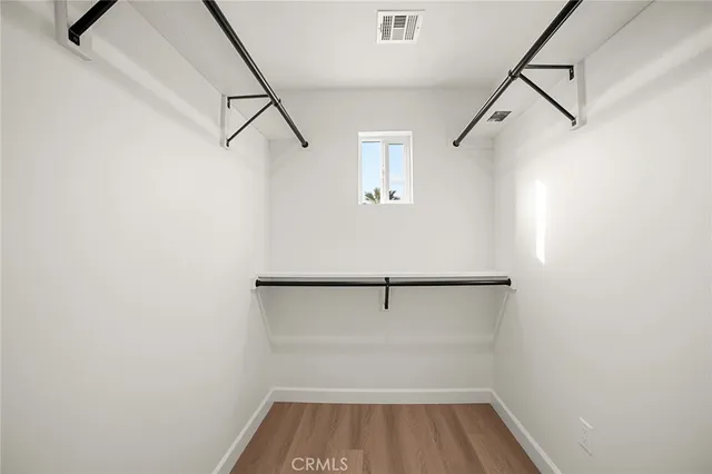 a view of an empty walk in closet