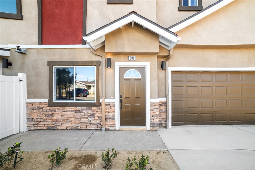 306 West Congress Street Colton, CA 92324 - Photo 25 of 28 a view of front door of a house with a street