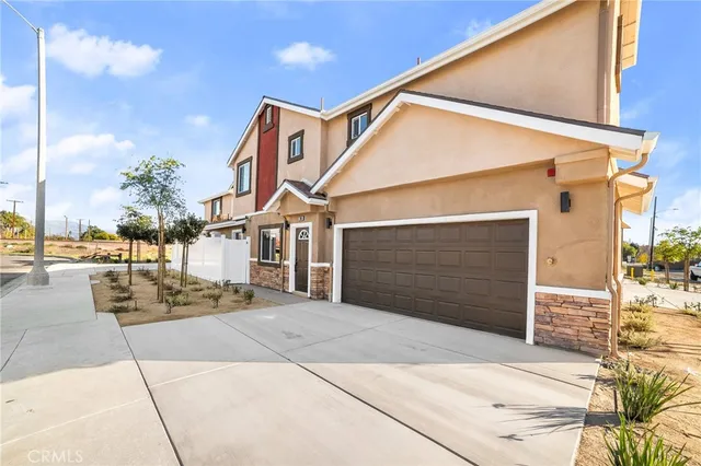a front view of a house with a garage