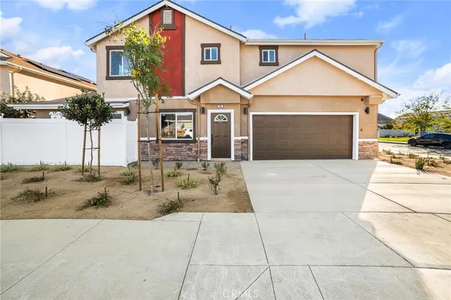 a front view of a house with yard