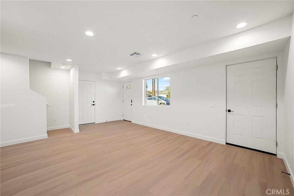 306 West Congress Street Colton, CA 92324 - Photo 5 of 28 a view of an empty room with wooden floor and a window