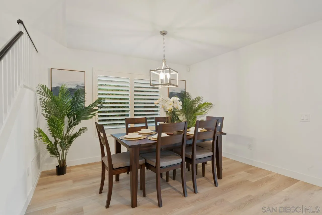 1904 Willow Ridge Drive Vista, CA 92081 - Photo 16 of 70 a dining room with furniture and potted plants