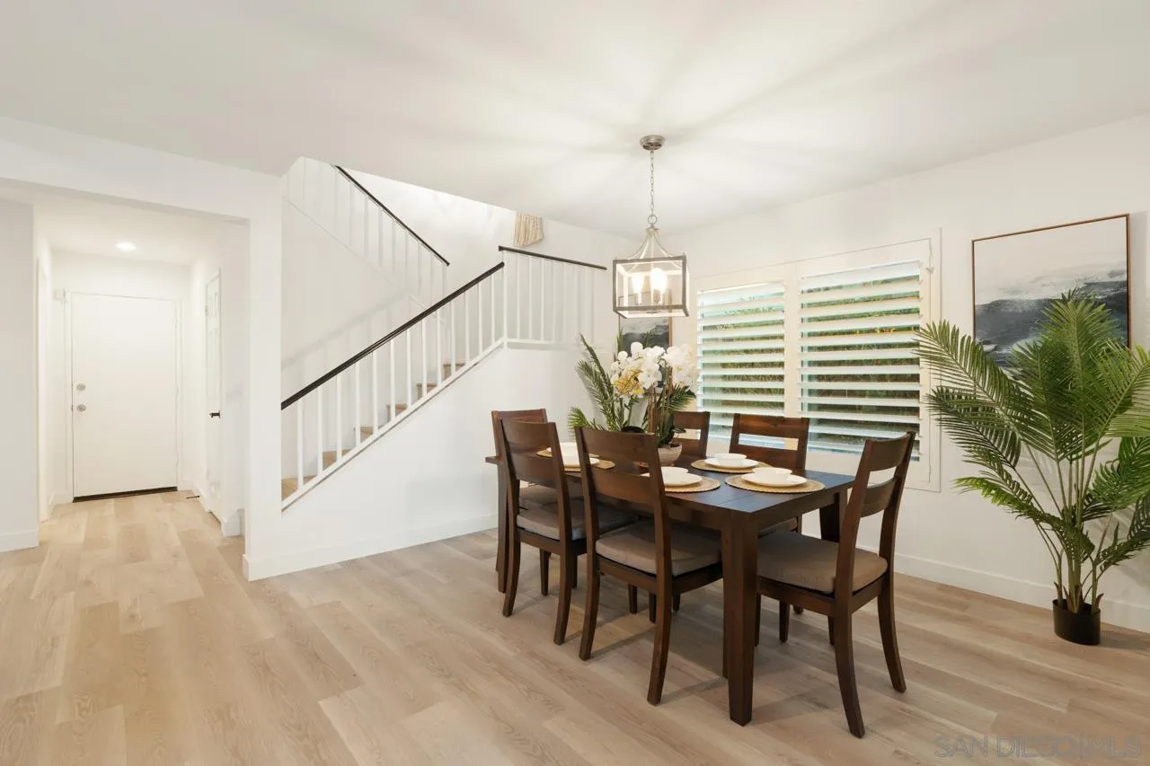 1904 Willow Ridge Drive Vista, CA 92081 - Photo 19 of 70 a view of a dining room with furniture and wooden floor