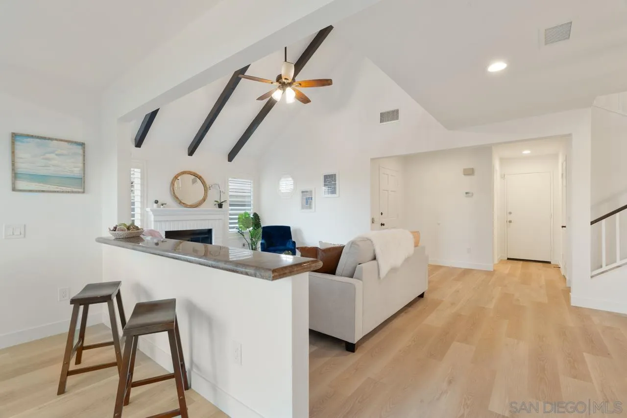 1904 Willow Ridge Drive Vista, CA 92081 - Photo 21 of 70 a living room with furniture and a clock