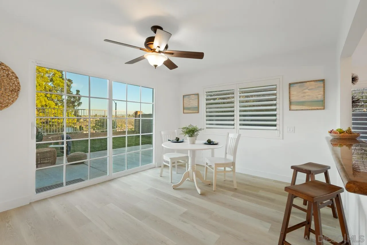 1904 Willow Ridge Drive Vista, CA 92081 - Photo 22 of 70 a dining room with furniture a window and wooden floor