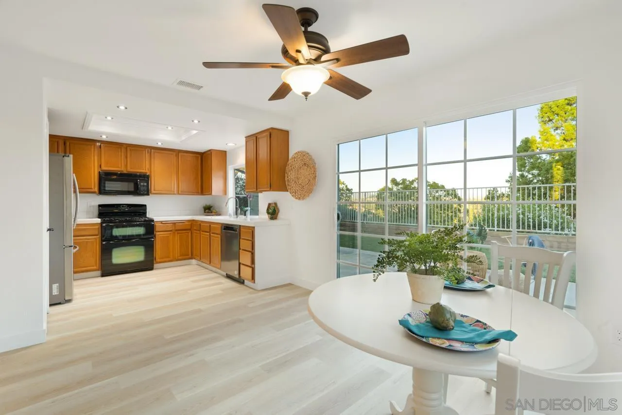 1904 Willow Ridge Drive Vista, CA 92081 - Photo 25 of 70 a kitchen with a table and chairs