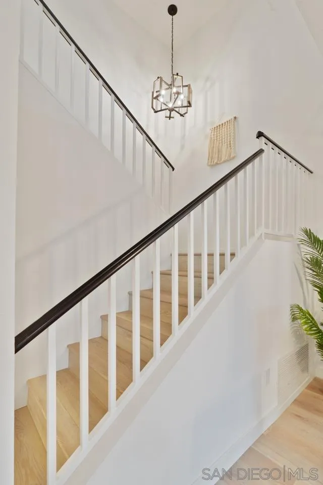 1904 Willow Ridge Drive Vista, CA 92081 - Photo 32 of 70 a view of staircase with railing and a chandelier