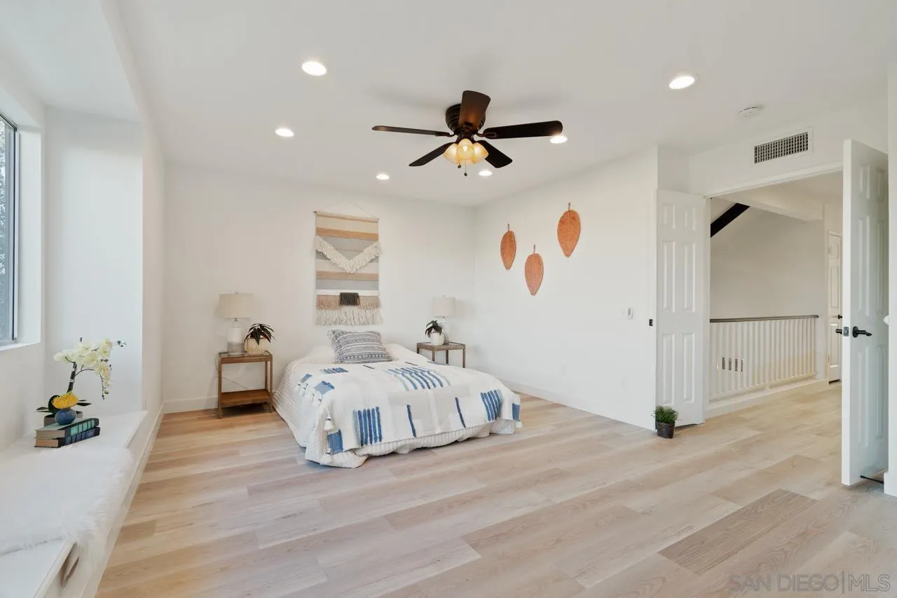 1904 Willow Ridge Drive Vista, CA 92081 - Photo 42 of 70 a room with a bed and wooden floor