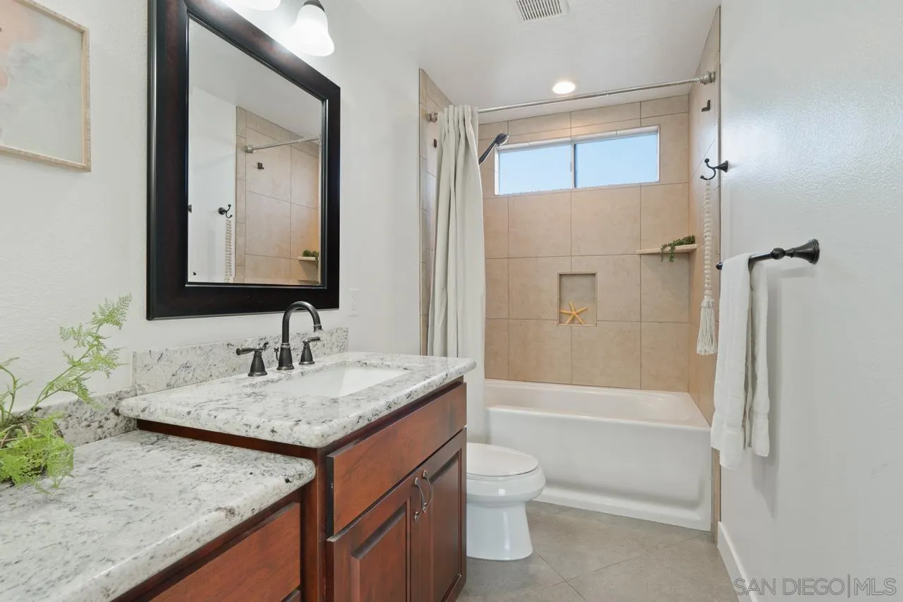 1904 Willow Ridge Drive Vista, CA 92081 - Photo 46 of 70 a bathroom with a granite countertop sink toilet and shower