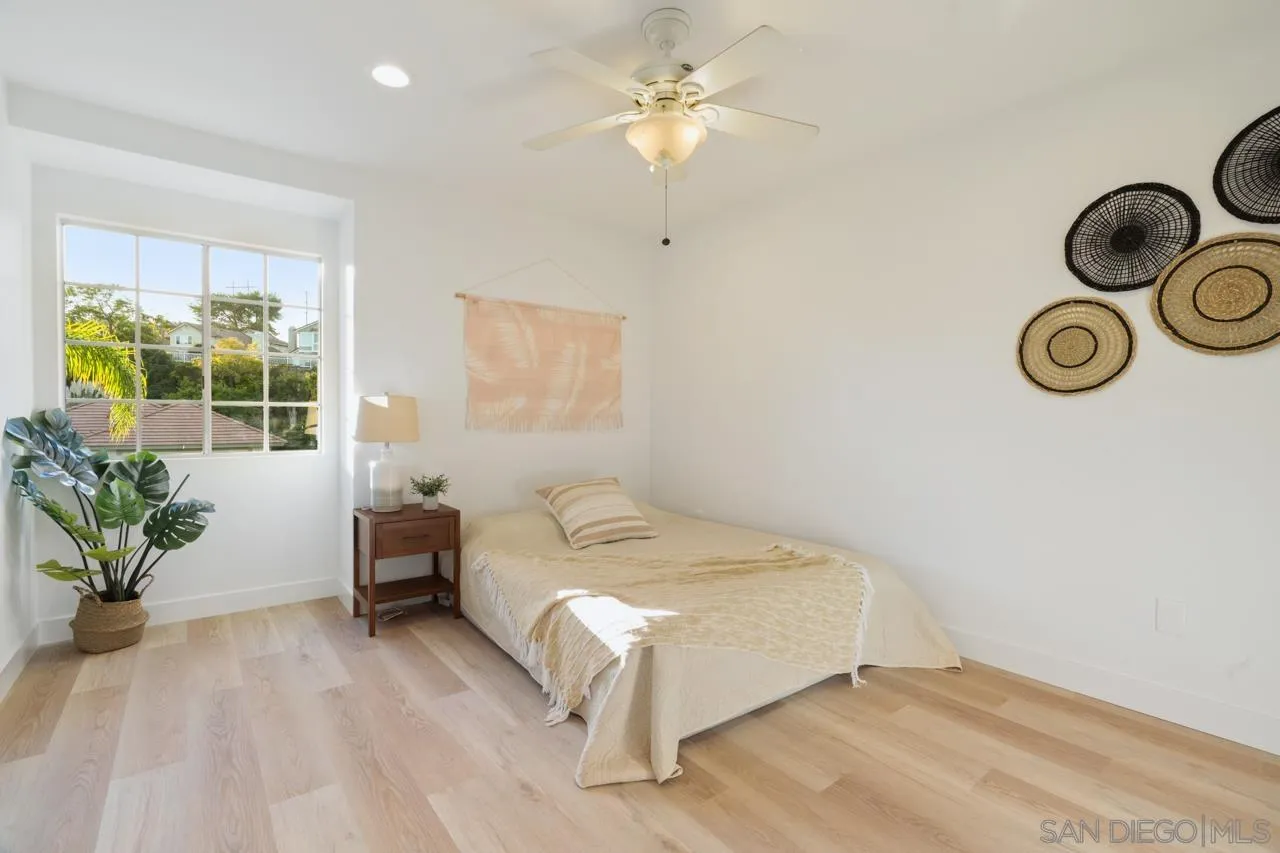 1904 Willow Ridge Drive Vista, CA 92081 - Photo 52 of 70 a bedroom with a bed and a chandelier